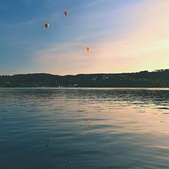Colorful hot air balloon is flying at sunset. Brno Dam - Czech Republic.