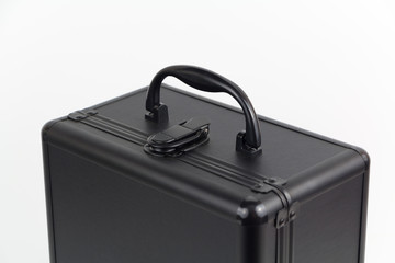 Black luxury suitcase isolated on white, closeup