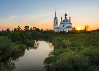Fototapeta na wymiar Sunset in the village Savinskoye, Yaroslavl region. Russia. The Church Of The Nativity Of The Blessed Virgin.