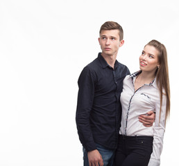 Young happy couple showing presentation pointing on placard over