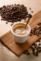 Coffee-flavored yogurt with coffee beans around