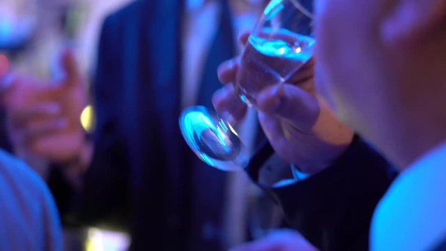 Man drinking wine during a party 
