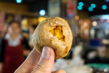 The close up of Taiwan deep fried taro ball at food street night market in Taipei.