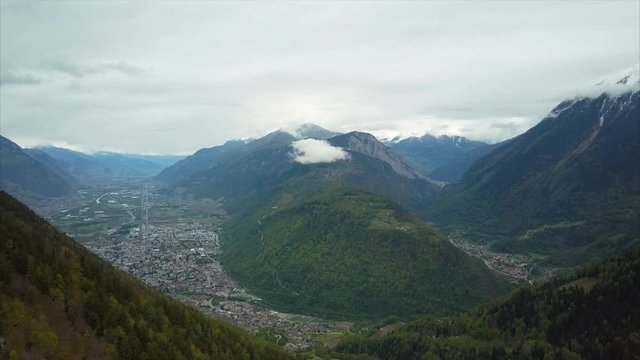 Amazing Aerial View of Small Town, Valley and Mountains in Switzerland at Summer Time