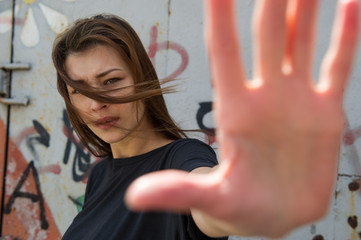 young woman in sunglasses forbids