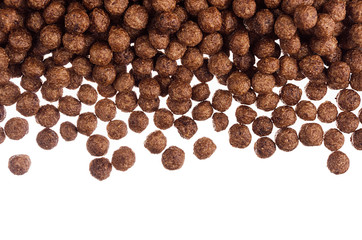 Decorative frame of chocolate balls corn flakes isolated with copy space background.