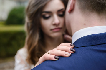 Loving couple walking in the park near the castle.