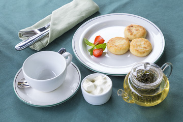 Breakfast with tea and cheesecakes