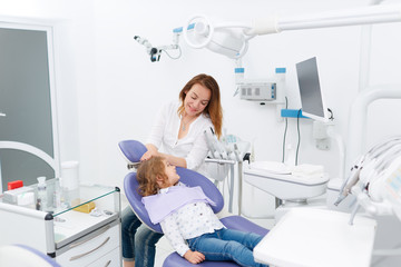 Dentist and child in cabinet