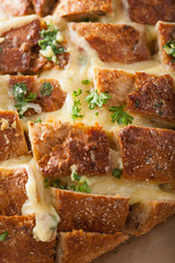 baked party bread with melted cheese butter herbs