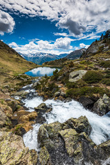 Fototapeta na wymiar Stream flowing towards lake Tristaina,Andorra