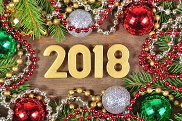 2018 year golden figures and spruce branch and Christmas decorations