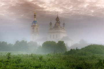 Foggy sunrise in the village Savinskoye, Yaroslavl region. Russia. The Church Of The Nativity Of The Blessed Virgin. 