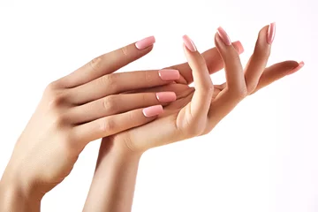 Rolgordijnen Mooie vrouw handen op lichte achtergrond. Zorg over de hand. Tedere handpalm. Natuurlijke manicure, schone huid. Roze nagels © marinafrost