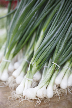 Fresh onions on the market, Colorful photo of onions with green background, Selective focus with shallow depth of field
