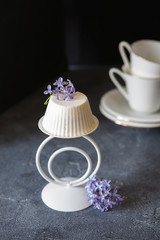 Vanilla mousse cake with edible lilac