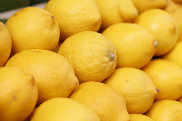Lemons on the market, Colorful photo of lemons with defocused background, Selective focus with shallow depth of field