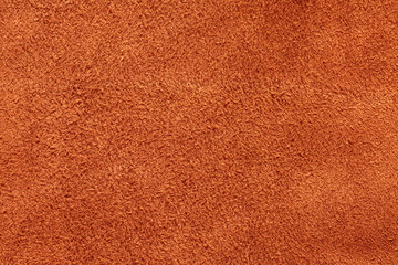 Orange suede texture background, closeup, long fiber