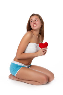 Girl with red heart in hands