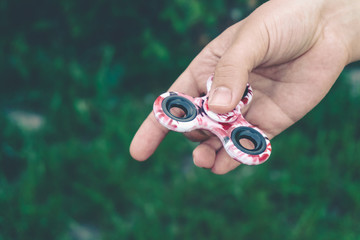 Girl playing with a fidget spinner