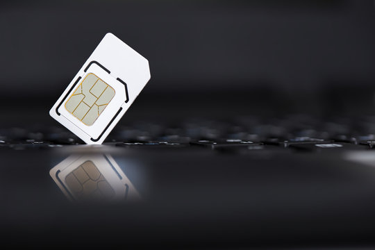 Sim card put on black laptop computer