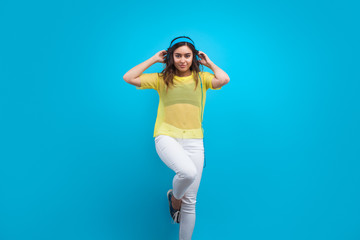 Stylish teen posing in earphones