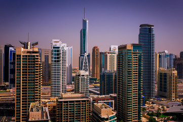Fototapeta premium Amazing colorful dubai marina skyline with water canal and expensive yachts, Dubai, United Arab Emirates.
