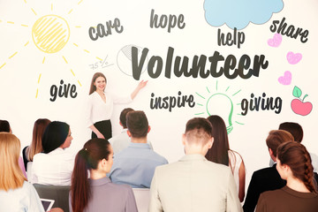 Business trainer giving presentation to group of people