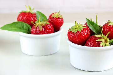 Ripe strawberries anf mint in a bowl