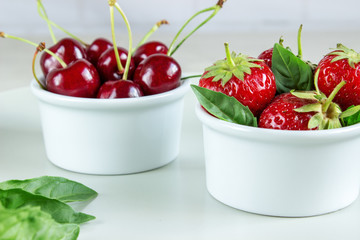 Ripe strawberries, mint and black cherry