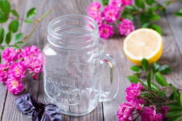 Obraz na płótnie Canvas Glass jar for lemonade on a wooden background