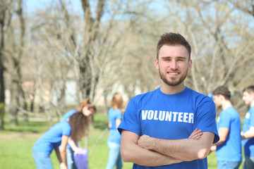 Naklejka premium Handsome young volunteer outdoors