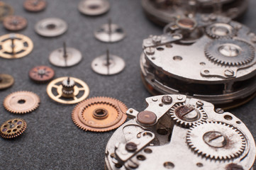 Detail of watch machinery on the table.
