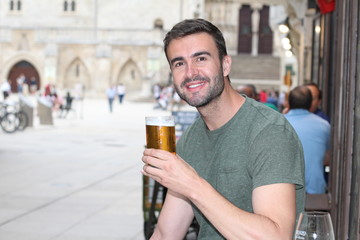 Man enjoying a nice drink outside with copy space