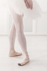 Ballerina legs closeup in fourth position
