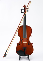 Fototapeta na wymiar Violin with bow isolated on white background. Classical stringed musical instrument fiddle with fiddlestick.