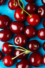 crowded group of ripe cherries, making approach