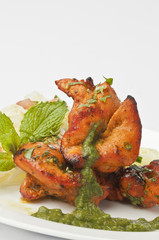 Boneless chicken tikka with mint dip and fresh salad