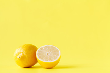 Yellow lemon cutted half on table with pattern