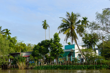 Fototapeta premium Riverside stilt houses in the Mekong Delta
