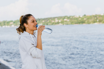 Girl drinking water after workout