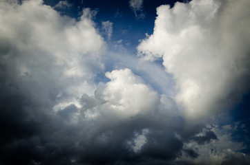 Dramatic sky. Saturated clouds before a thunderstorm, against the background of a blue sky.