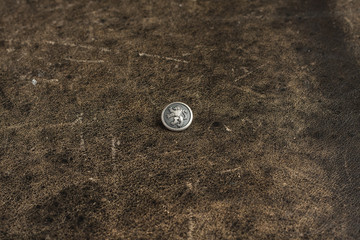 Metal button on the texture table