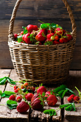 Fresh,organic strawberry in the old basket