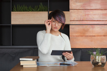 Trendy girl posing with tablet