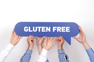 Group of people holding the GLUTEN FREE written speech bubble