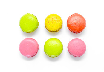 Colorful macaroons on white background.