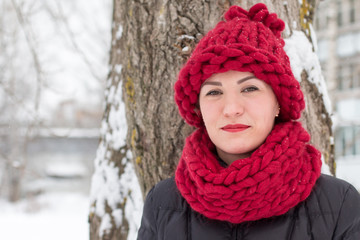 Cute girl in a warm hat in winter