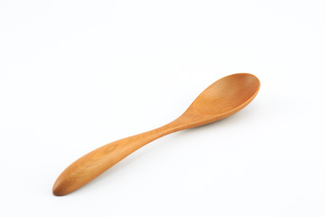 Brown wooden spoon, white background