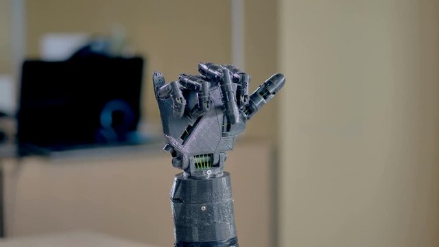Electric robotic arm moving its fingers. 4K.